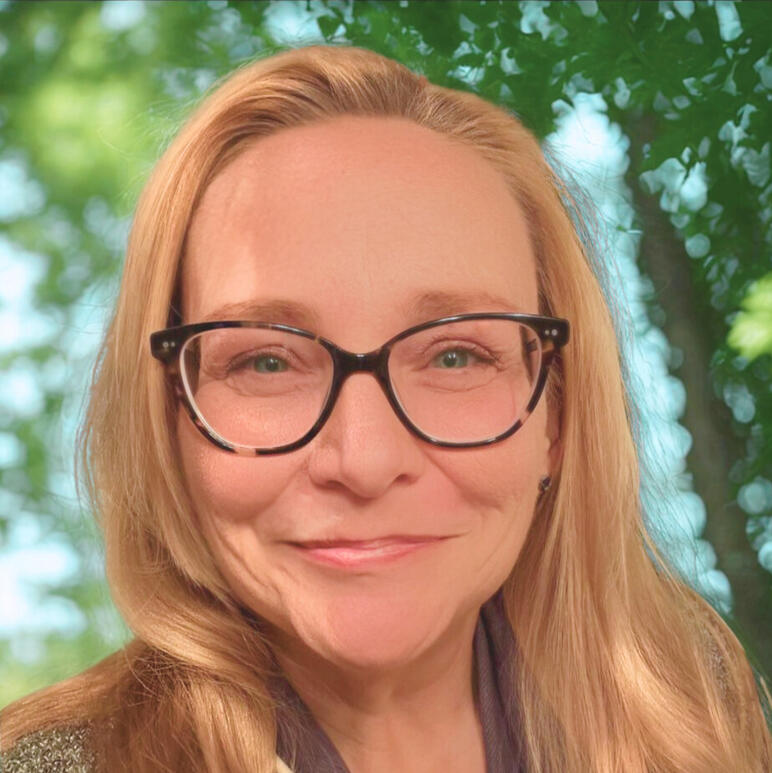 Roxann Grover, MA photo of a woman wearing glasses